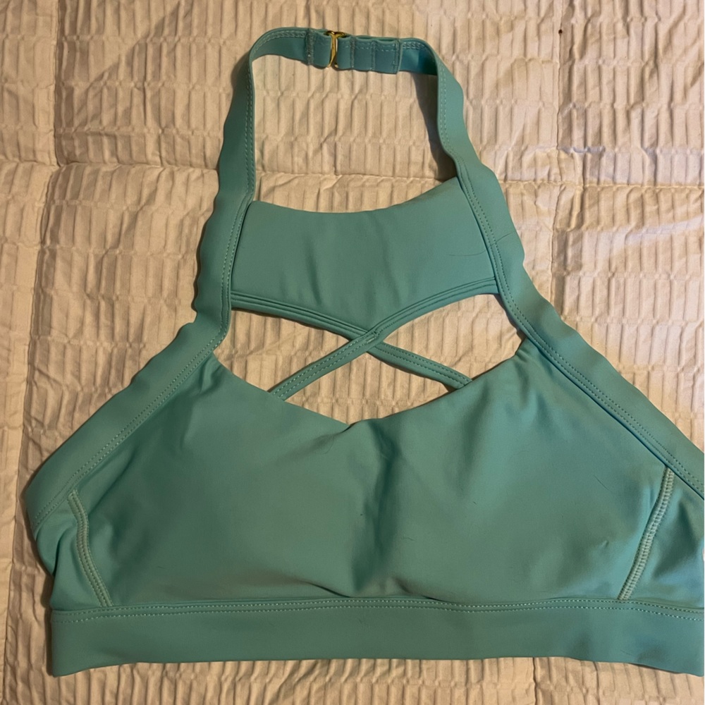 Chestee sports bra with removable collar bone pads.
